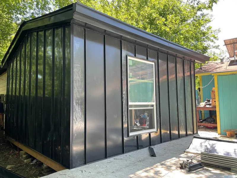 Black standing seam metal wall panels for Roof Inspection in Mims